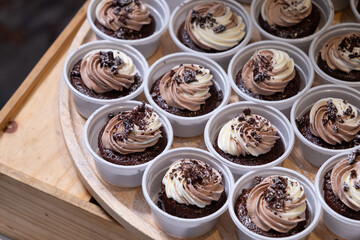 chocolate cupcakes on wooden plate in wedding party reception