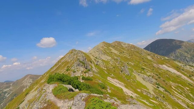 Hiking to Ostredok hill on Otrhance mountain ridge in Western Tatras mountains in Slovakia during beautiful summer day