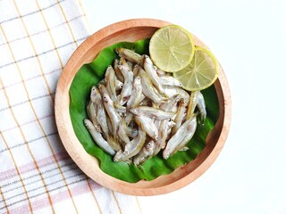 Fresh wader pari fish (Rasbora lateristriata) or spotted barb or common barb on banana leaf and...