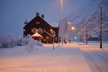 A view down the snow covered platform of Hjerkinn train station in the mountains of southern...