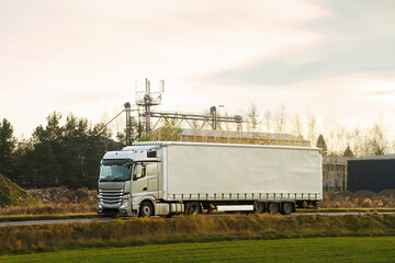 Industrial truck moving on countryside road