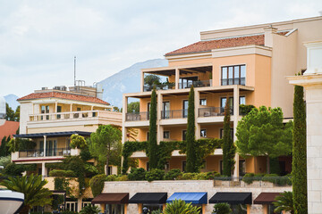 Apartment complex with green plants on balconies