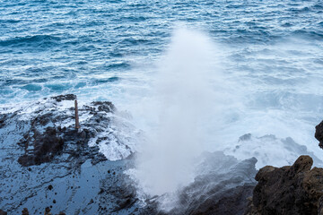 Heavy surf launches seawater skyward through Hawaii’s Halona Blowhole, capturing nature’s force at one of Oahu’s most thrilling coastal attractions.