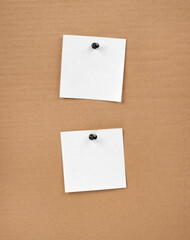 Blank notepaper and space for text with push pins on cardboard background. note blank paper cards. noticeboard on catron board. sticker. blanks for designers