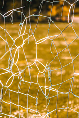 Fastened goal net on empty football field