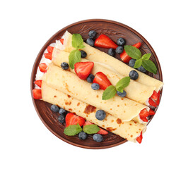 Tasty crepes with berries, cream and mint isolated on white, top view