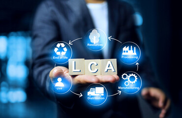 Life Cycle Assessment LCA concept with a man holding wooden dice environmental impacts of a...