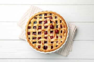 Tasty cherry pie on white wooden table, top view