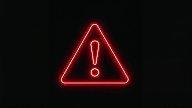 Glowing neon red triangle warning sign on dark background
