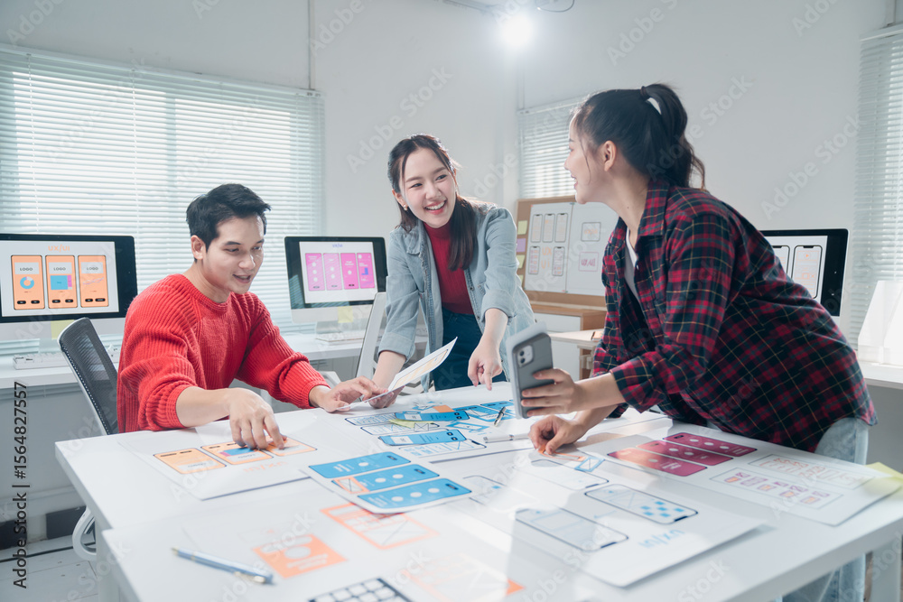 Poster group of young asian ux web designers working and collaborating together developing mobile app desig