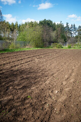 A plowed garden plot on a spring day