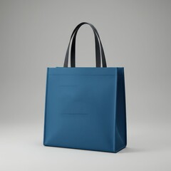Minimalist blue tote bag with black handles, designed for reusable shopping or everyday carry in a clean, modern style.