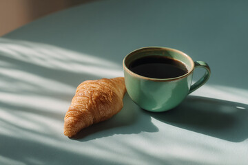 Delicious and elegant breakfast of a croissant and a coffee