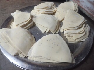 Raw Samosa ready to be fried  famous Indian snack food,How to make crispy and flaky samosa,A very...