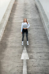 Confident Woman Standing on Path with Arrow
