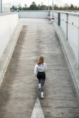 Woman Jogging on Urban Concrete Ramp