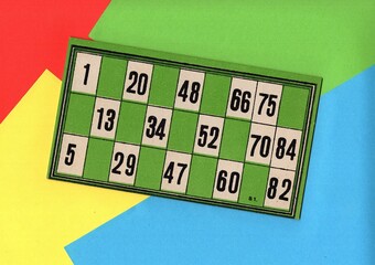 Content from the vintage game of Lotto or Bingo on a bright coloured background.