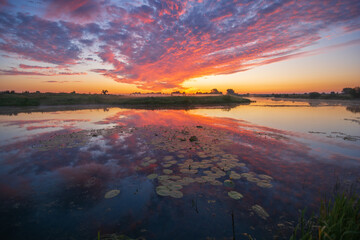 orange sunrise sky over the lake