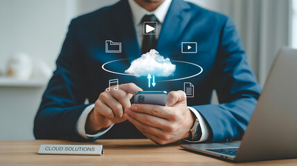 Cloud Data Management: A businessman's focused use of the cloud, highlighting the efficiency and accessibility of data in the digital era.
