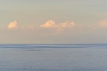 scenic sunrise or sunset above sea water with beautiful ocean vawes , nice golden evening clouds...