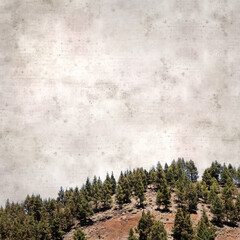 square stylish old textured paper background with orange volcanic gravel mountain Montana del...