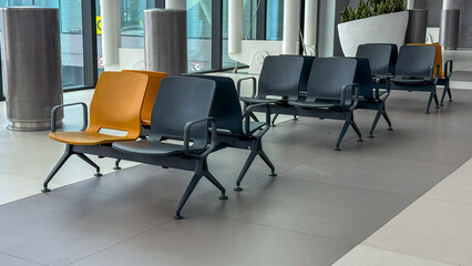 Empty chairs in a serene airport lounge, evoking solitude and anticipation, perfect for International Travel Day reflections