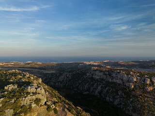 An aerial view showcases the rugged, rocky landscape of Casares Canyon, with unique geological...