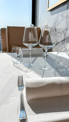 Sunlit elegance on a minimalistic table setting evokes refined contemplation and whispers of Sibling's Day and Slow Living