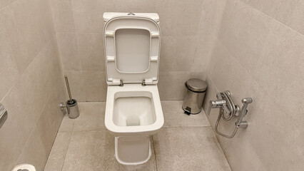 Pristine white toilet awaits contemplative solitude, World Plumbing Day sanctuary, reflective zen...