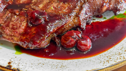 Succulent grilled steak, drenched in tart cherry glaze, evokes midsummer barbecue revelry and the enigmatic tales of St Georges Day
