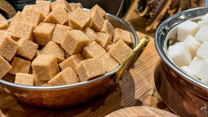 Brassy bowls brimming with rustic sugar cubes evoke sweet indulgence, perfect for Pancake Day and...