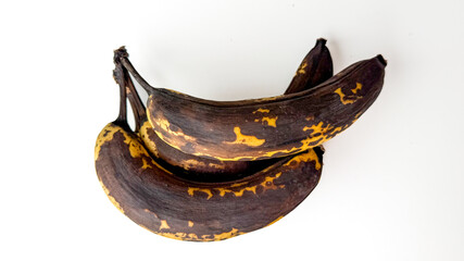 Overripe bananas, mottled with nostalgia, evoke rustic Caribbean harvest rituals and the...
