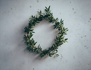 Fototapeta premium Simple Green Wreath on a Speckled Backdrop