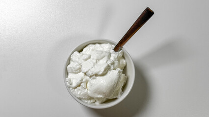 Creamy clouds of yogurt in a bowl, rich probiotic dreamscape, celebrating World Fermentation Day, Nordic dairy delight