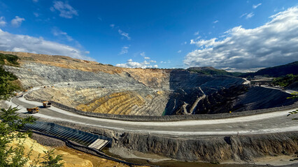 Majestic quarry labyrinth under azure sky, evoking Industrious Labor Day vibes, geological wonders meet artisanal stewardship, Earth Day essence