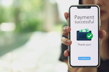 A successful payment notification message appears on the customer's smartphone screen when they make a payment via an online banking application.