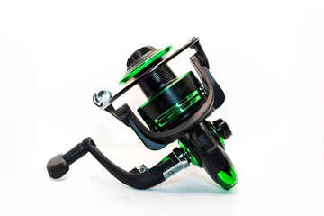 Green fishing reel with fishing line isolated on white background, ideal for outdoor activities sports. Photos from all angles and sides.