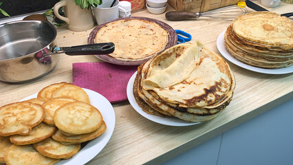 Pancakes stacked like golden treasures evoke Maslenitsa warmth, culinary pancake artistry, kitchen nostalgia, and Shrove Tuesday indulgence
