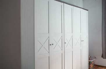 Classic wardrobe furniture in a bedroom.