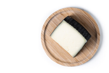 Close-up of a wedge of semi-cured cow's cheese isolated on white background. Top view. Copy space