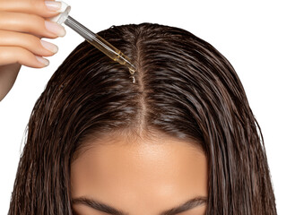 Obraz premium A woman applies hair serum to promote wellness. Nourishing serum provides a silky hair and overall wellness. isolated on a white background