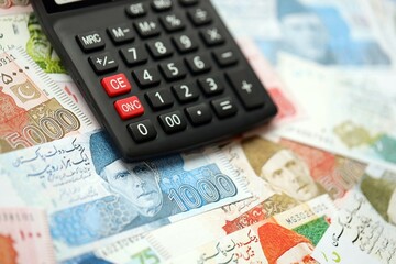 Pakistan rupees banknotes and calculator. The current Pakistan money bills with calculator