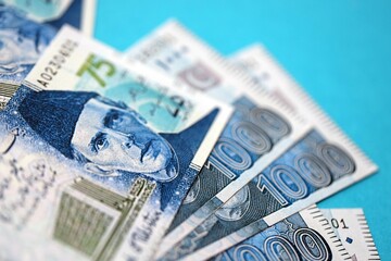 Pakistan rupees banknotes on blue background. The current Pakistan money bills