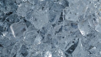 Ice, frozen, cold, transparent, clear – a close-up view of crushed ice pieces, glistening with light, showing sharp texture and natural beauty, ideal for cooling drinks, food styling, or backgrounds.

