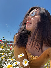 Woman Relaxing in a Field of Wildflowers