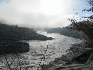 morning mist over rapid waters in the valley