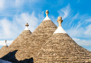 Beautiful trulli buildings in Alberobello, Italia. Conic tile roofs of trulli near Bari in Italy....