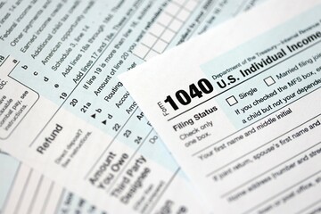 1040 US individual income tax return form blank close up. Few pages of united states tax blank