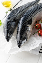fresh mackerel fish carcass on a bright table. fish in the oven on the grill. raw, unpeeled fish