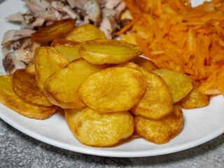 A side dish for dinner, crispy fried potato slices